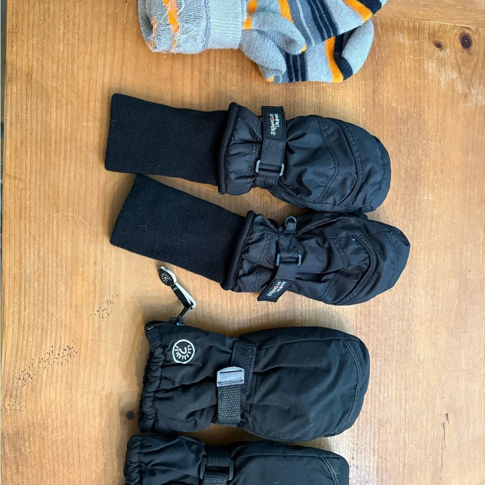 2 pairs of black ski mittens and   ski socks for ages 4-6